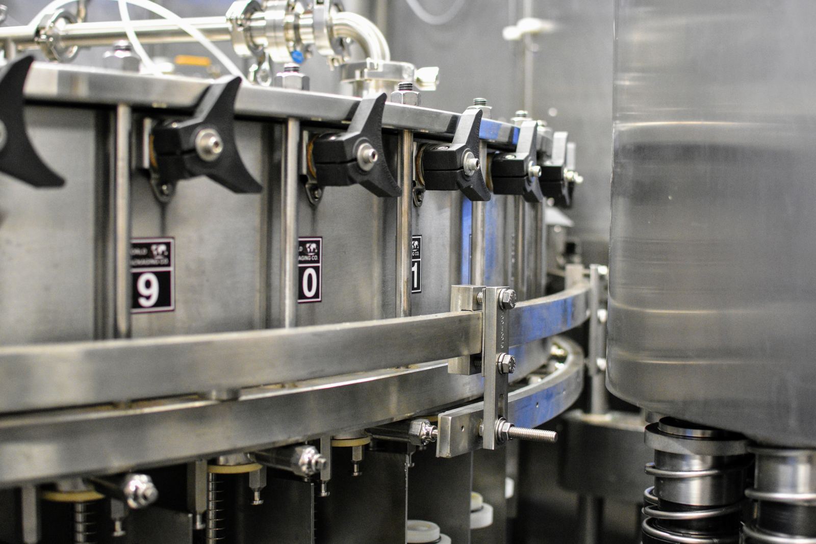 Close-up of filling valves on a rotary filler