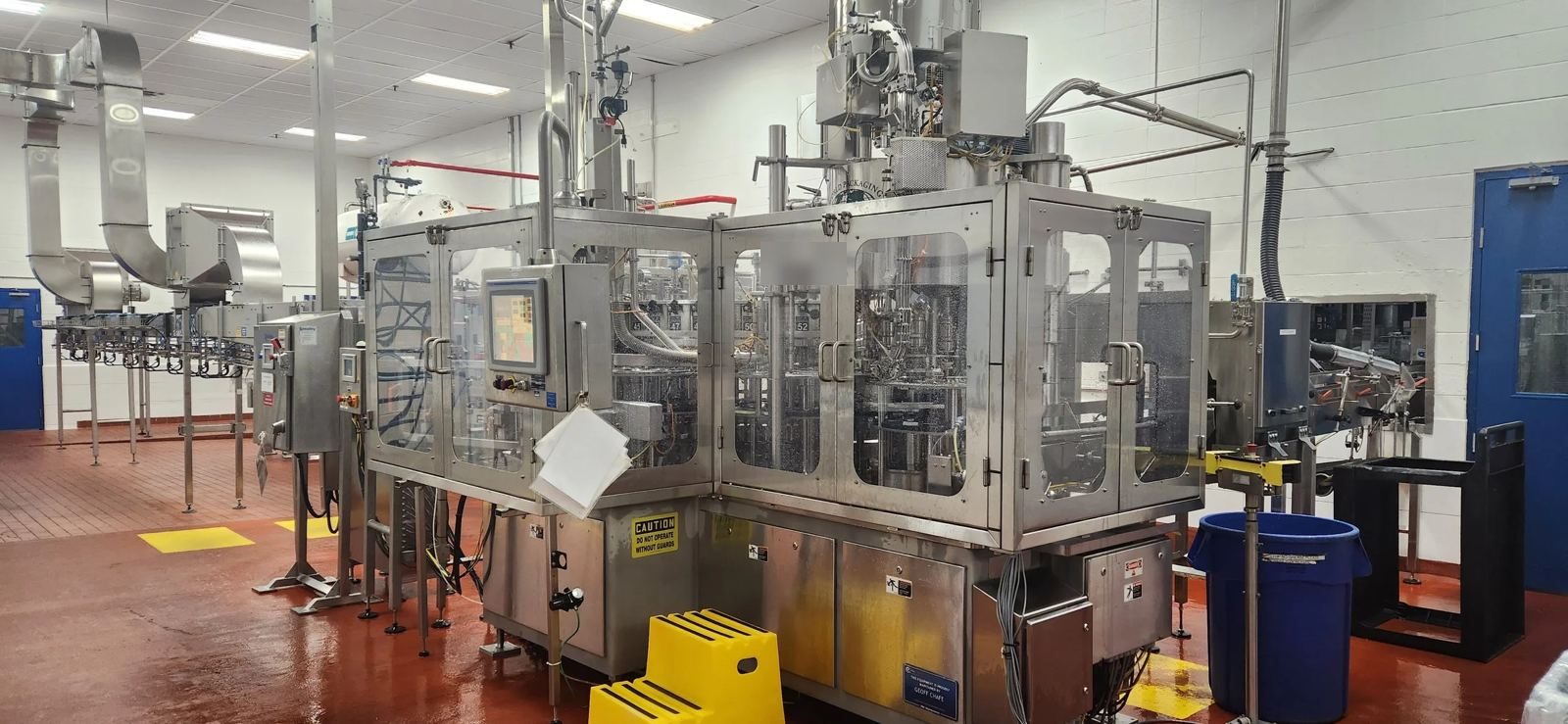 Rotary monoblock filler in a soft drink bottling plant