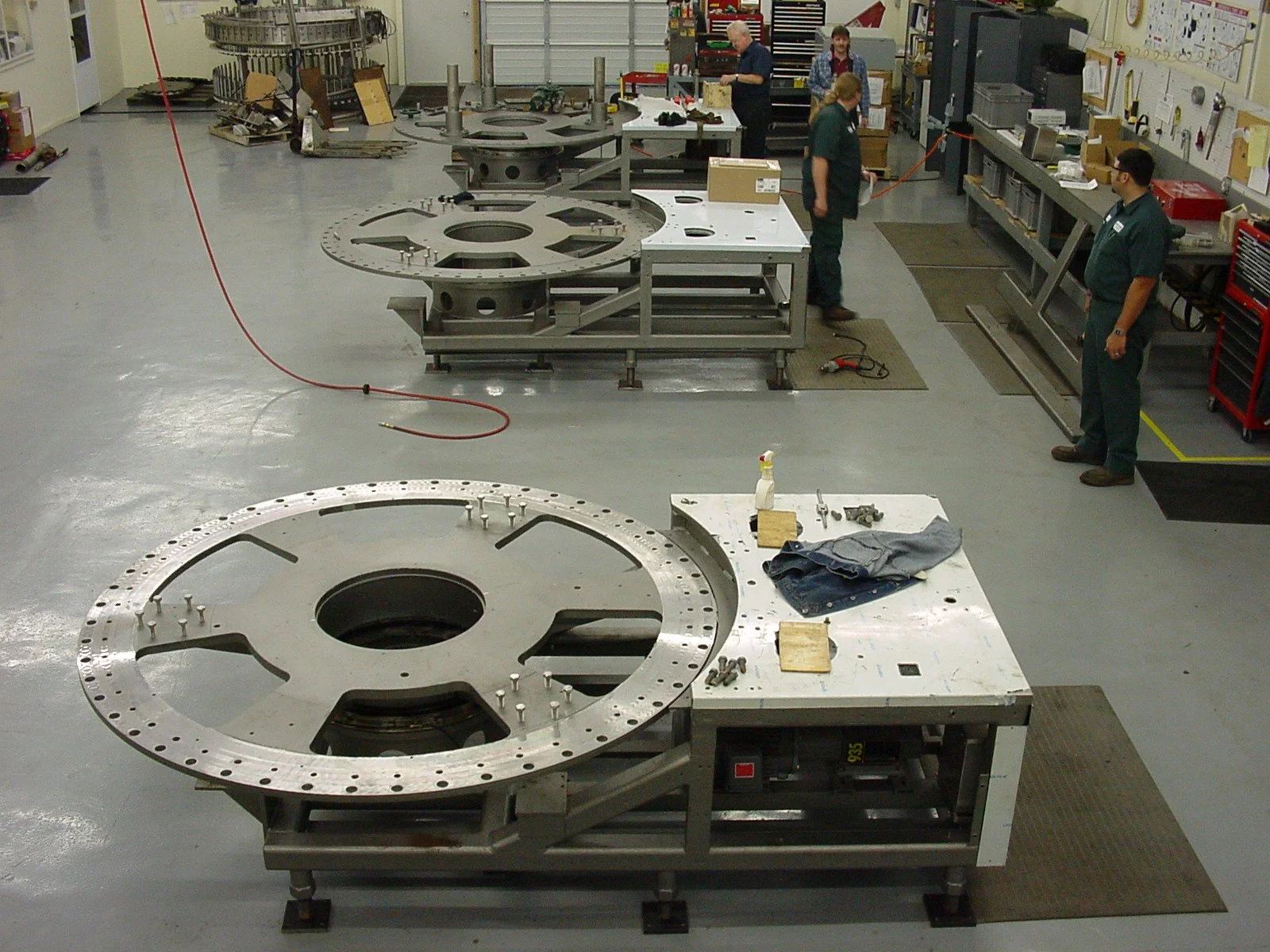 Technicians working on a filler in the World Packaging shop